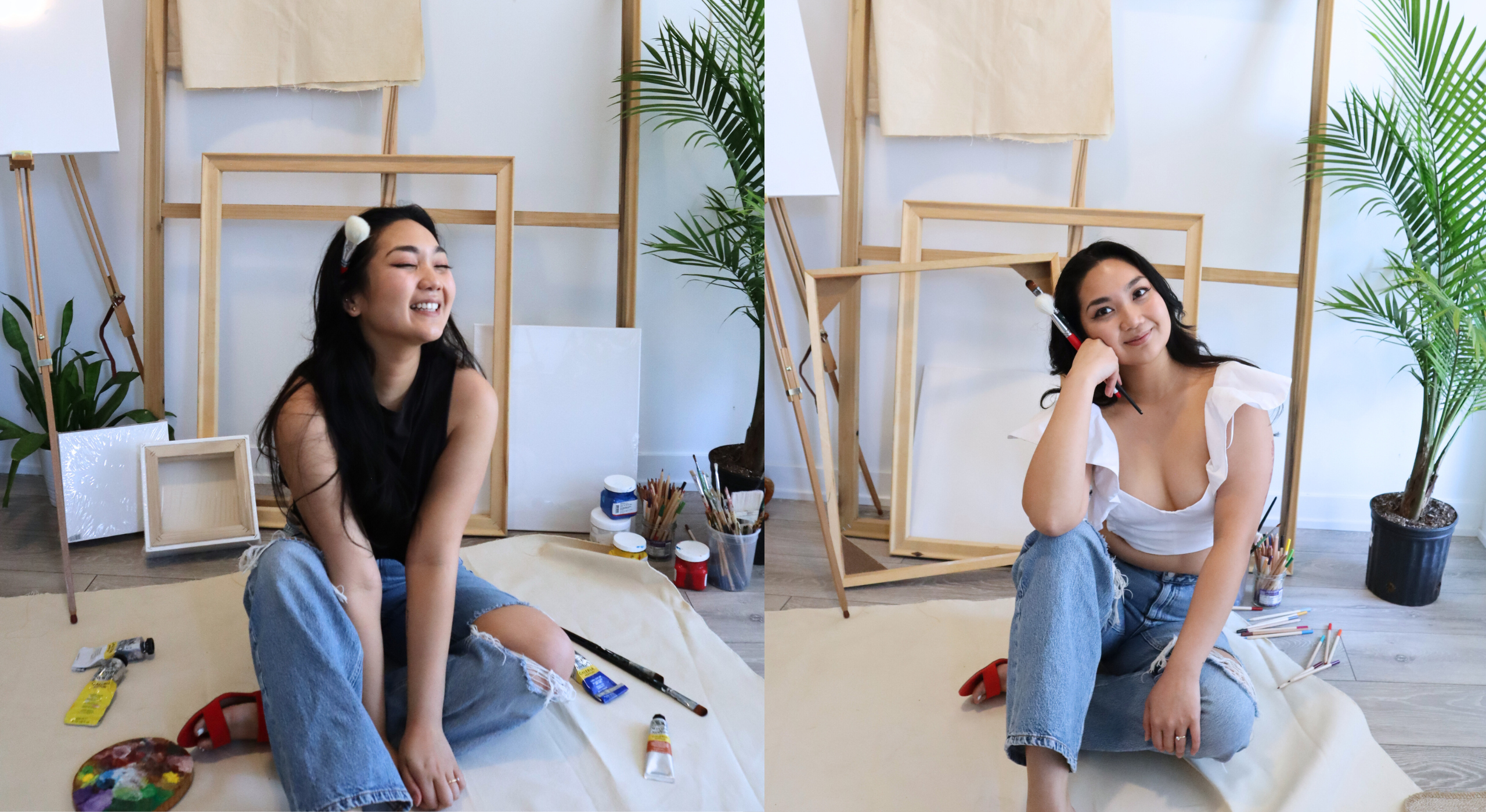 filipino asian artist smiling for the camera with paintbrushes and acrylic paint is scattered everywhere, with blank canvases in the background with greenery plants and more paint brushes